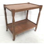 A Beaverman oak two tier trolley, raised on casters, height 74cm, length 76cm, width 48cm.