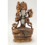 A good Chinese gilt bronze, gilt painted and white jade figure of Buddhistic immortal seated cross-