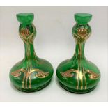 A pair of late 19th, early 20th century Art Nouveau green glass vases with sinuous leaf gilded