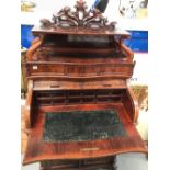A good Victorian ladies tambour writing cabinet of serpentine form, the raised top with open shelf