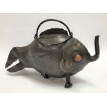An oriental bronzed spelter teapot in the form of a fish with hardstone eyes, length 33cm (AF).