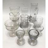 Collection of antique glass to include two rummers, two mugs with loop handles, a toasting glass,