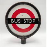 A vintage enamel bus stop sign, diameter 33cm, together with an enamelled bus stop request sign,