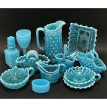 Twelve pieces of blue opaline pressed glass wares.