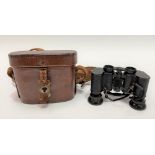 A leather cased small pair of Carl Zeiss Jena 3x13,5 binoculars.