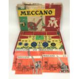 A Meccano boxed set 8 with a lift-out tray and four booklets (some losses), width 59cm.
