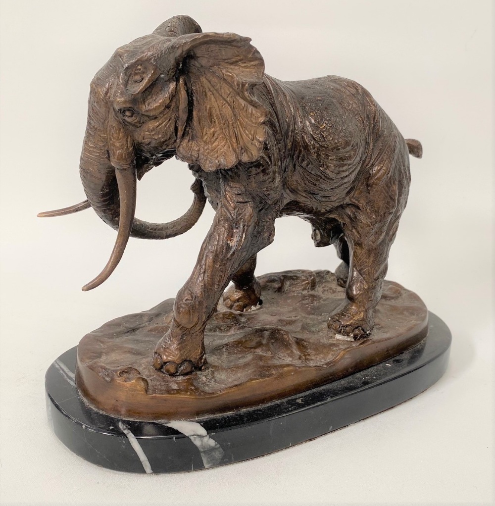 A modern bronze sculpture of a bull elephant upon a naturalistic oval base and with black marble - Image 2 of 2