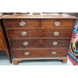 A George III mahogany straight-front chest of two short over three long graduated drawers upon