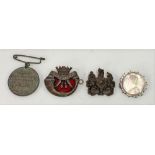 Victorian silver one Rupee 1887 brooch; together with a Cornwall Light Infantry badge, a bronze