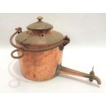 A copper range kettle with long spout and wrought iron swing handle, height 32cm