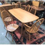 An Ercol blonde elm rectangular dining table with four splayed feet, 75 x 154cm, height 71cm