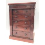 Small 19th Century mahogany tabletop Wellington chest of five drawers upon a plinth base, height