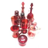 Collection of ruby cut and overlay glass wares, including a small scent bottle and stopper cut