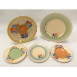 Two Clarice Cliff Newport Pottery crocus pattern plates; together with three crocus pattern side