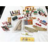 Collection of Dinky Toys petrol pump and garage parts, including Dunlop tyre stands, petrol pump