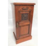 Edwardian walnut pot cupboard with carved fielded panel door, height 79cm.