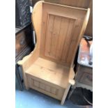 Stripped pine wing back lambing style chair, height 123cm.