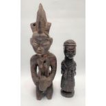 An African tribal Yoruba figure, height 46cm, together with another African tribal carved figure,