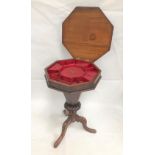 Victorian walnut veneered octagonal section work table with partially fitted interior and on three