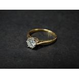An 18ct. gold diamond solitaire ring, the diamond of 0.66ct weight approx. and of VS clarity and
