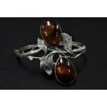 A modern silver amber set hinged bangle, weight 21.5g approx.