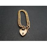 A 9ct. rose gold curb link bracelet with padlock clasp, weight 14g approx.