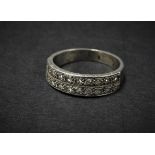 A platinum or white gold diamond set twenty stone half eternity ring, each diamond of 0.03ct