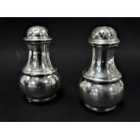 A pair of Victorian silver baluster pepperettes, maker MR, London 1872, height 8cm, weight 4.20oz