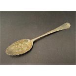 A George III Old English pattern berry spoon by Hester Bateman, the handle foliate scroll chased,