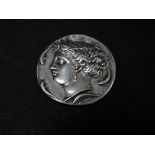 A reproduction silver Greek coin, weight 20g approx.
