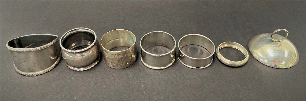 Six various silver napkin rings, five with hallmarks, the other stamped SILVER, together with a