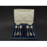A George V silver set of six teaspoons and sugar tongs within fitted case, maker JR, Sheffield 1919,