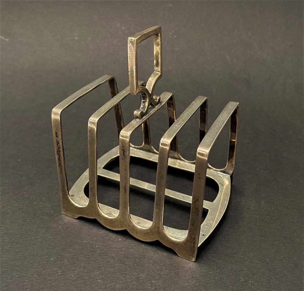 A George V silver four section toast rack, maker Harrison Brothers & Howson, Sheffield 1923, width