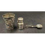 A Victorian silver export embossed miniature cup decorated with two putti amongst foliate scrolls