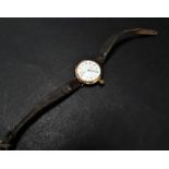 An early 20th century 9ct. hallmarked rose gold Waltham lug manual wind wristwatch, the 24mm white