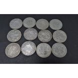 A collection of twelve George V & VI .500 silver half crown coins, weight 165.5g approx.