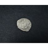 A Charles I silver penny.