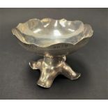 A George V silver engine turned pedestal bonbon dish, with wavy rim upon a weighted base with four