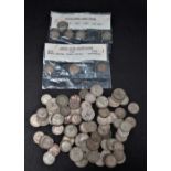 A collection of silver and .500 silver three pence and six pence coins, weight 146g approx.