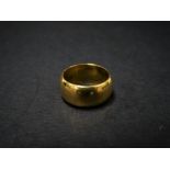 A 22ct. hallmarked gold band ring, size K, weight 9.7g approx.