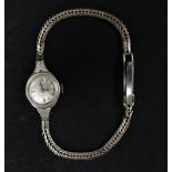 A ladies 9ct. gold manual wind bracelet wristwatch by Rotary, the 12mm silvered dial with baton