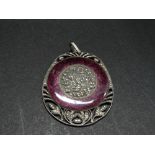 A 935 silver purple guilloche enamel marcasite set pendant, foliate carved and the edge pierced with