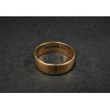 A 12ct. hallmarked gold band ring, size T, weight 3.7g approx.