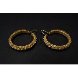 A pair of high purity Indian gold hoop earrings set with numerous filigree flowerheads, diameter