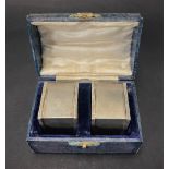 A pair of George VI heavy engine turned square section napkin rings within fitted case, maker T & S,