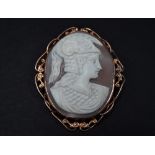 A 9ct. gold mounted oval shell cameo brooch, marked 9ct, 54 x 41mm.