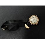 An early 20th century 9ct. gold cased ladies manual wind wristwatch.