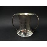 A George V silver twin handled flared cup with engraved decoration, maker William Hutton & Sons Ltd,