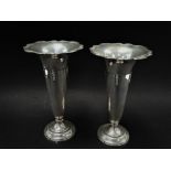 A pair of George V silver pedestal trumpet weighted spill vases, maker's mark worn, Birmingham 1919,