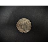 An Edward I silver penny.